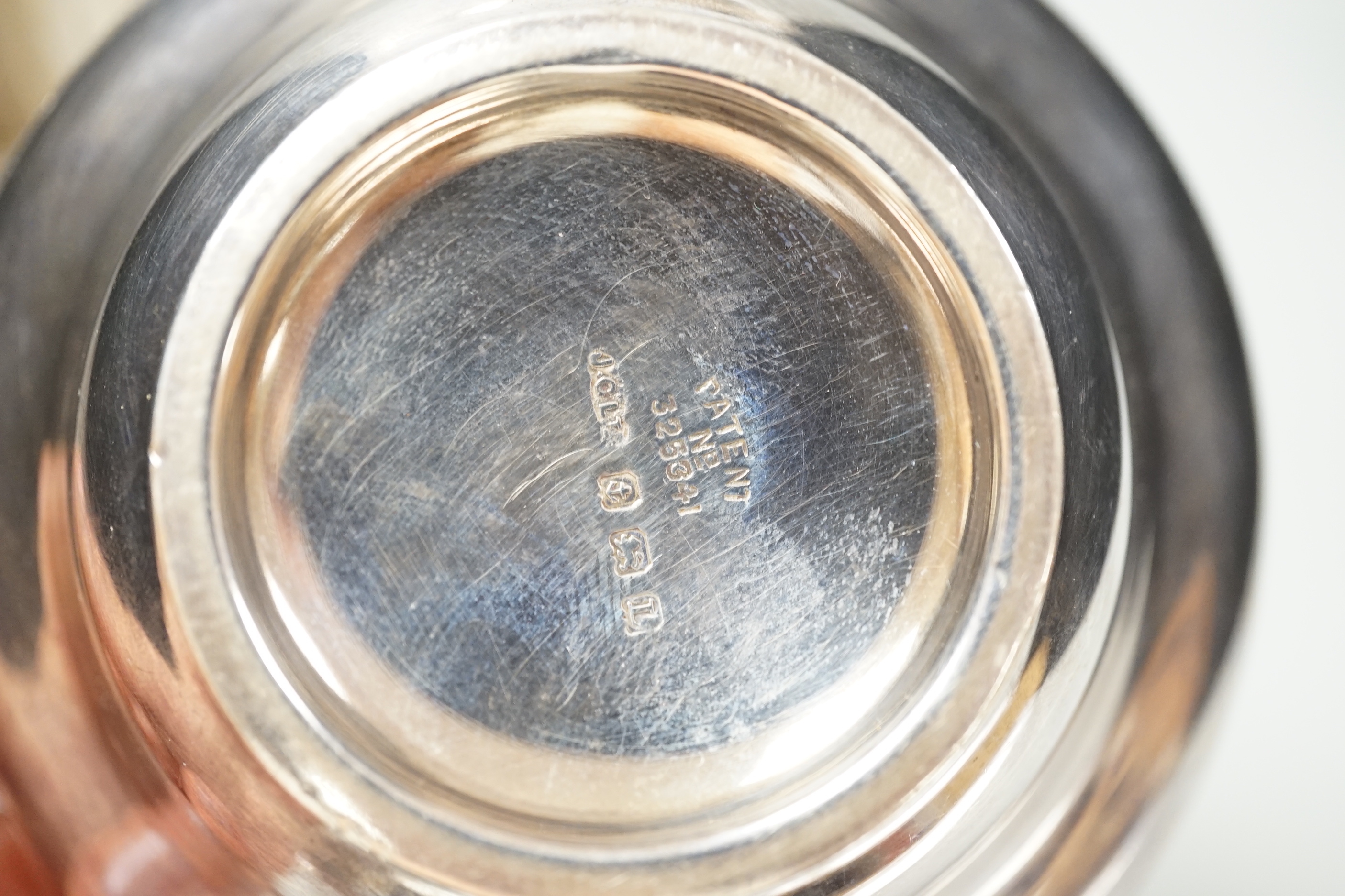 An early 19th century Viennese repousse white metal holy water stoup, 11.4cm, together with a cased 1930's silver spoon and mounted silver bowl.